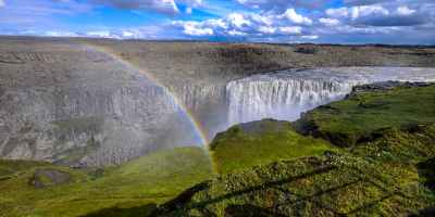 Image of rainbow over a waterfall.