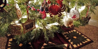 Christmas tree skirt and low-hanging ornaments