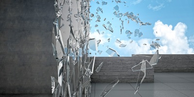 shattering glass exterior of a building