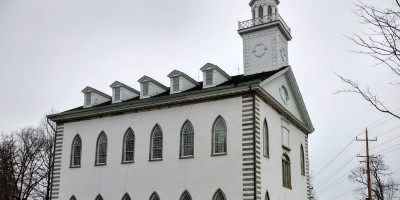 Kirtland Temple, first temple of Mormonism, as seen from the side on a cloudy day in 2018