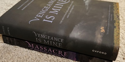 Photograph of two books. One is titled Massacre at Mountain Meadows. The other is titled Vengeance is Mine.