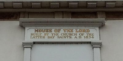 A sign on the front of the Kirtland Temple reading, "House of the Lord, Built by the Church of the Latter Day Saints. A.D. 1834